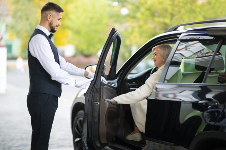 parking-valet-helping-woman-park-her-car